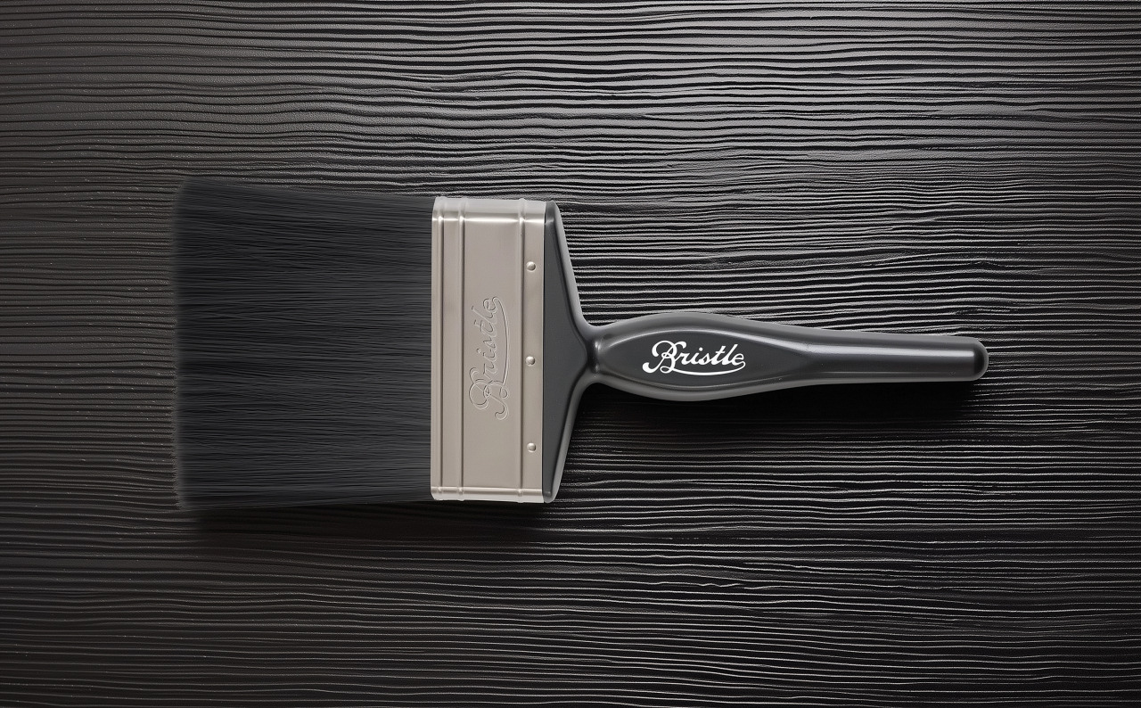 Paintbrush with the Bristle logo on a black background